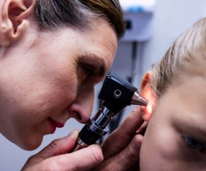 female-doctor-examining-patient-ear-with-otoscope-2021-08-28-16-45-03-utc-min.jpg
